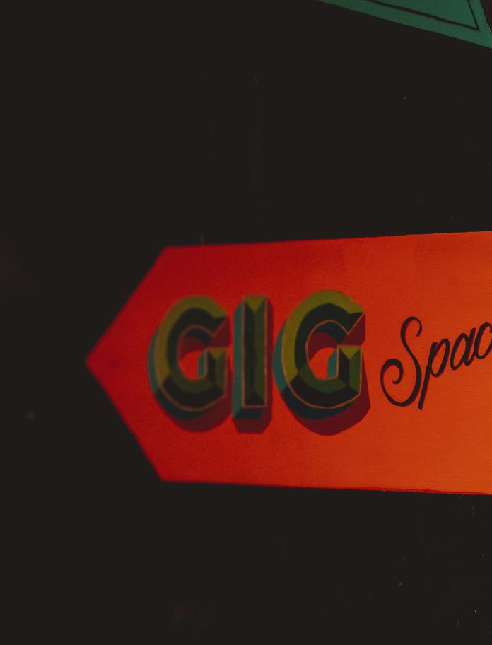 red sign with black writing saying 'GiG Space'