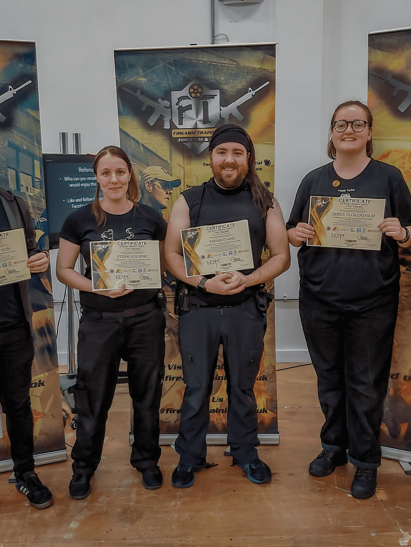 Five young people showing their training certificates to the camera