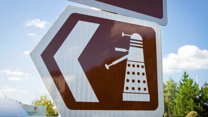 A brown tourist sign for Dr Who